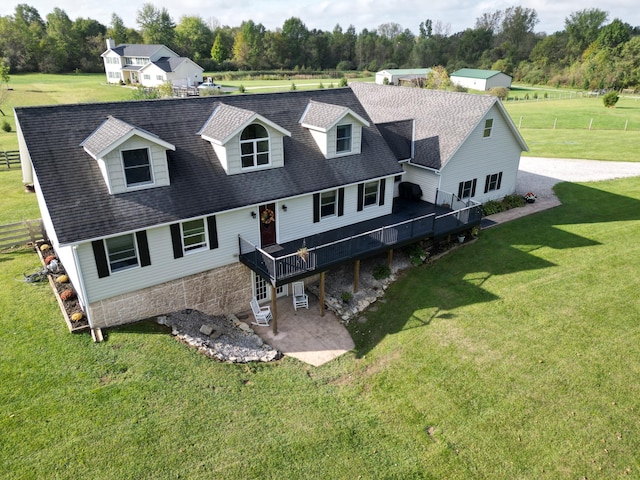 exterior space with a lawn, a patio, and a deck