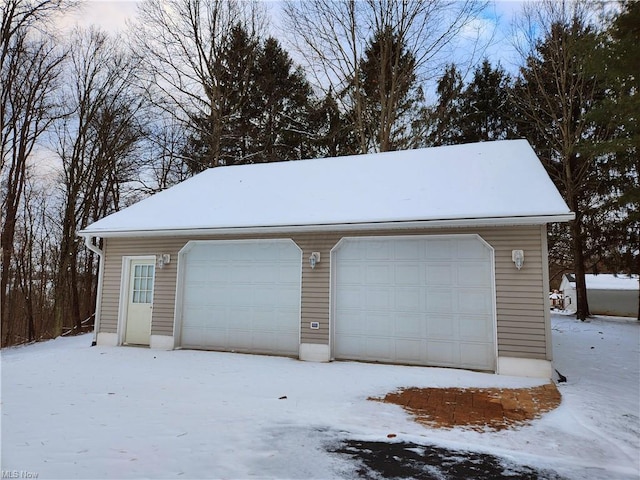 view of snow covered garage