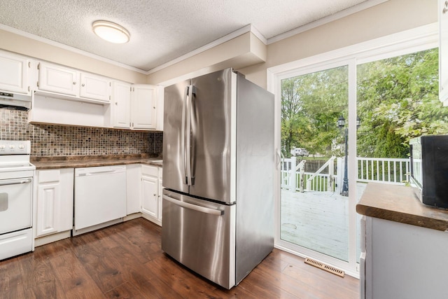 kitchen featuring crown molding, white cabinets, dark hardwood / wood-style floors, and white appliances