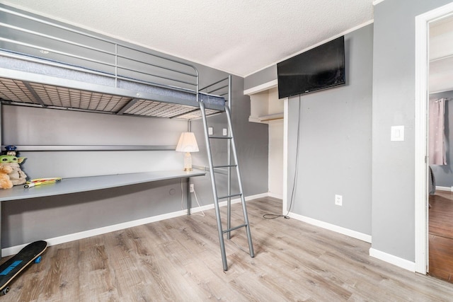 unfurnished bedroom featuring light wood-type flooring