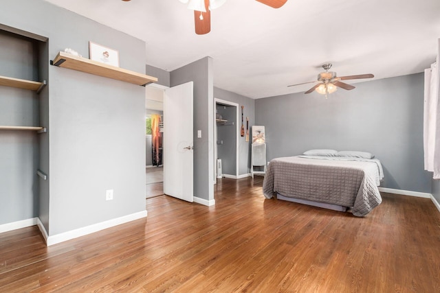 bedroom with hardwood / wood-style flooring and ceiling fan