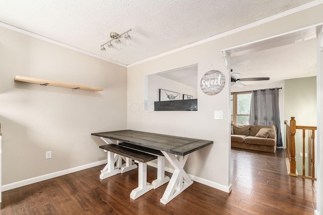 dining area featuring a textured ceiling, crown molding, ceiling fan, and dark wood-type flooring