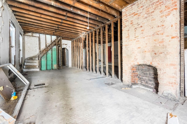 miscellaneous room featuring brick wall