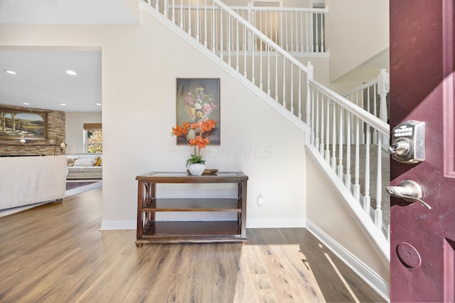 stairs featuring wood-type flooring