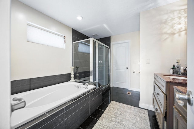 bathroom featuring tile patterned floors, plus walk in shower, and vanity