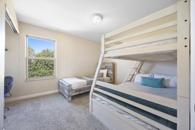 bedroom featuring light carpet