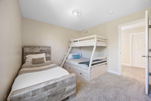 bedroom with light colored carpet