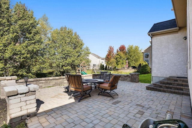 view of patio with a playground