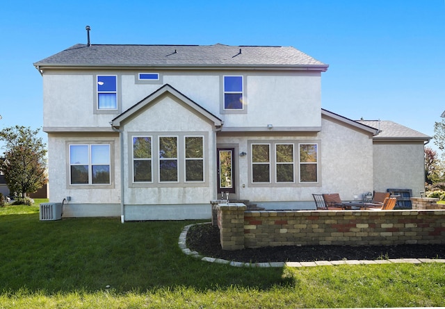 back of house with a lawn, cooling unit, and a patio