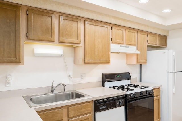 kitchen featuring white appliances, sink, and light brown cabinetry