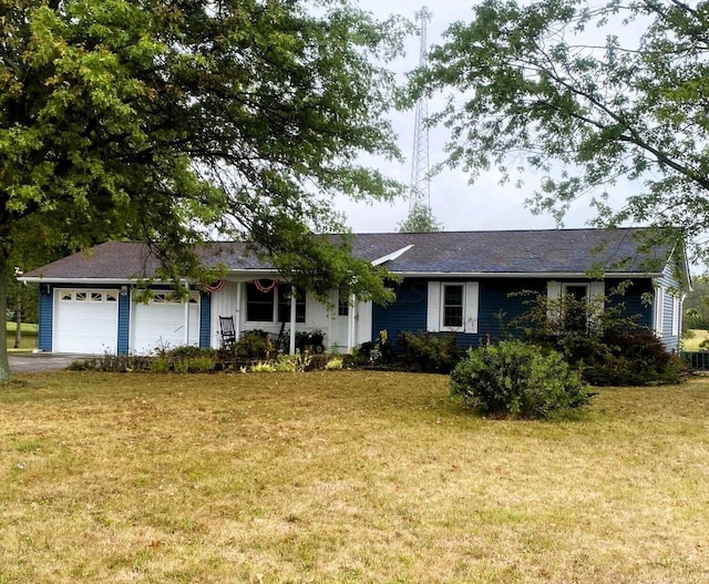 ranch-style home with a front yard and a garage