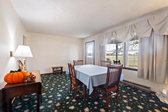 view of carpeted dining area