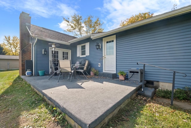 rear view of property featuring a patio