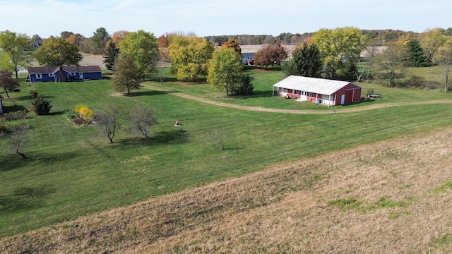 birds eye view of property with a rural view