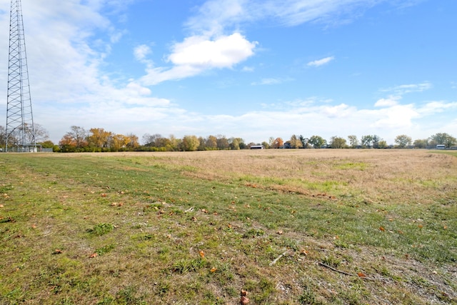 view of yard with a rural view