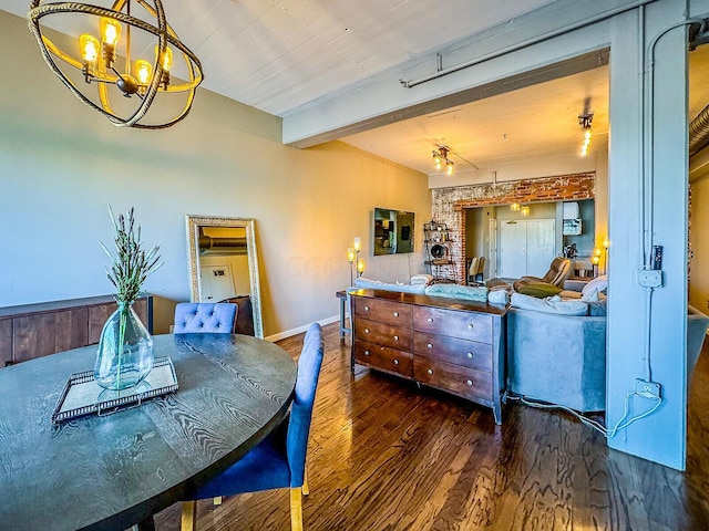 dining space featuring beamed ceiling, dark wood-type flooring, and an inviting chandelier