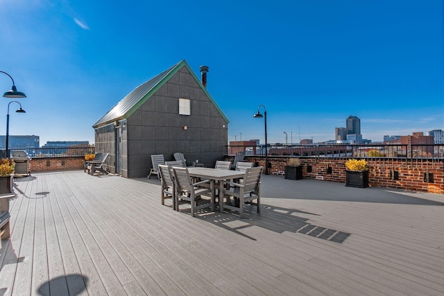 wooden deck with grilling area