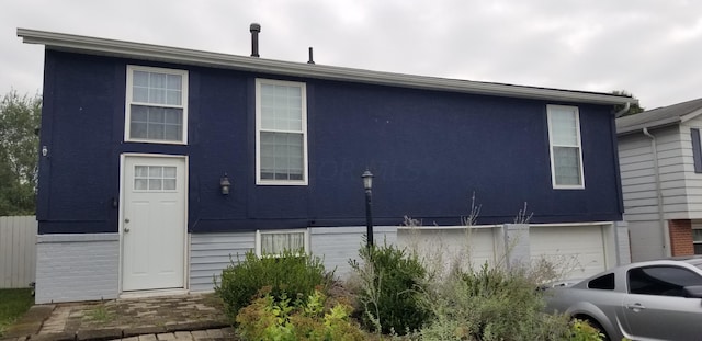 back of house with a garage