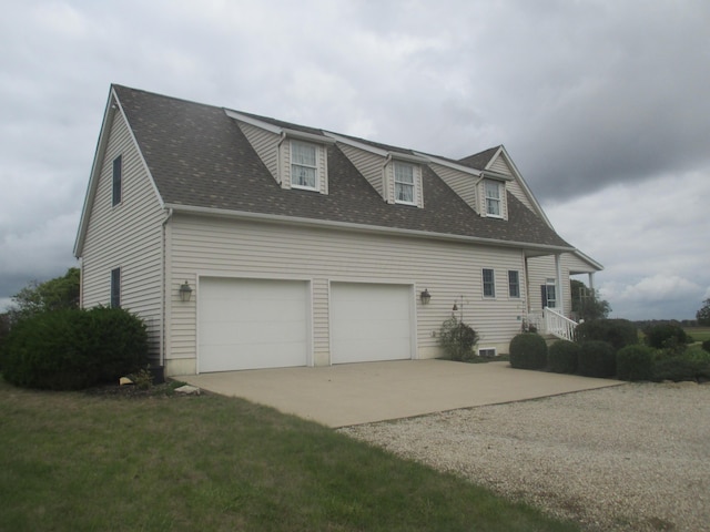 view of side of home with a garage