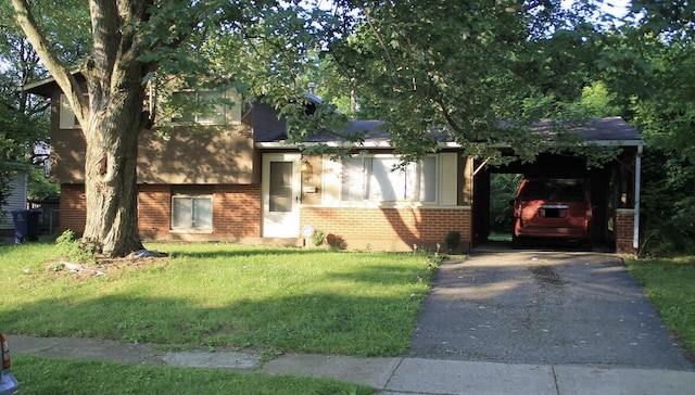 tri-level home featuring a carport and a front yard