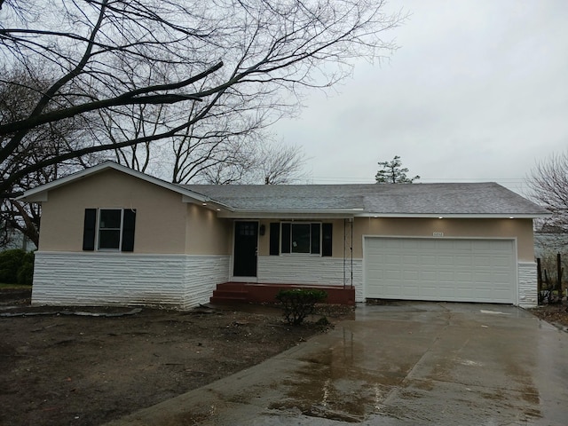 ranch-style home with a garage