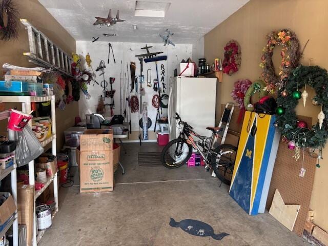 garage featuring white fridge