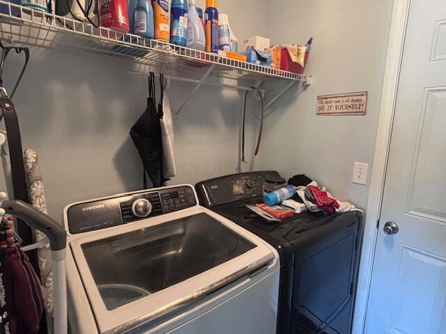 laundry room featuring independent washer and dryer