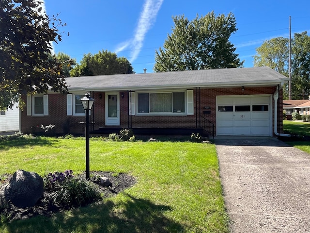 single story home with a garage and a front lawn