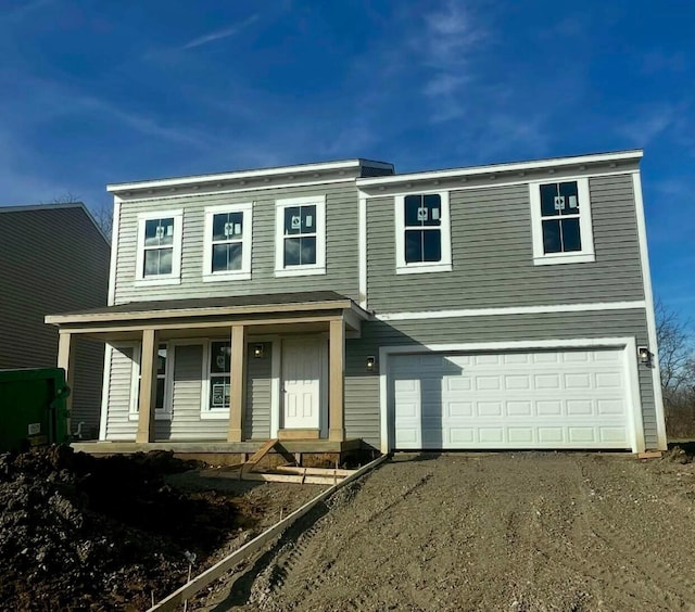 view of front of home with a porch and a garage