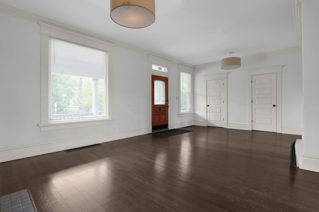 entryway with dark wood-type flooring and ornamental molding