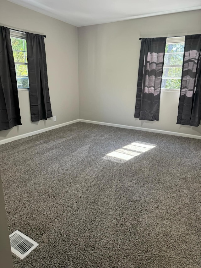 empty room with carpet flooring