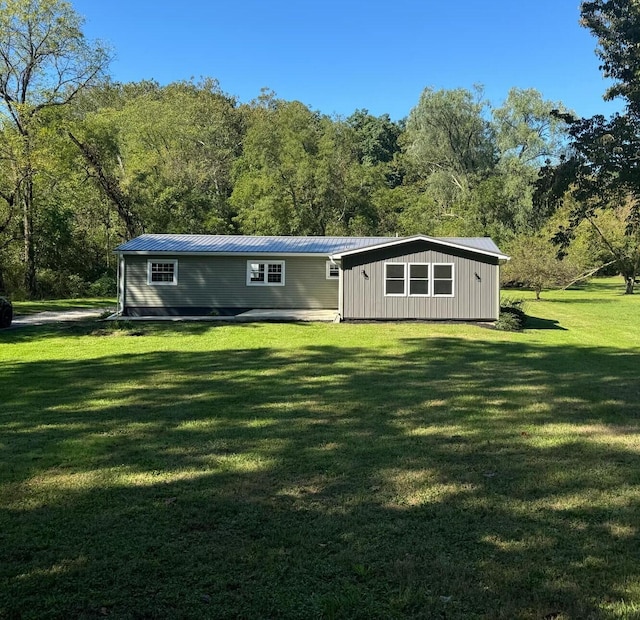 back of house with a yard