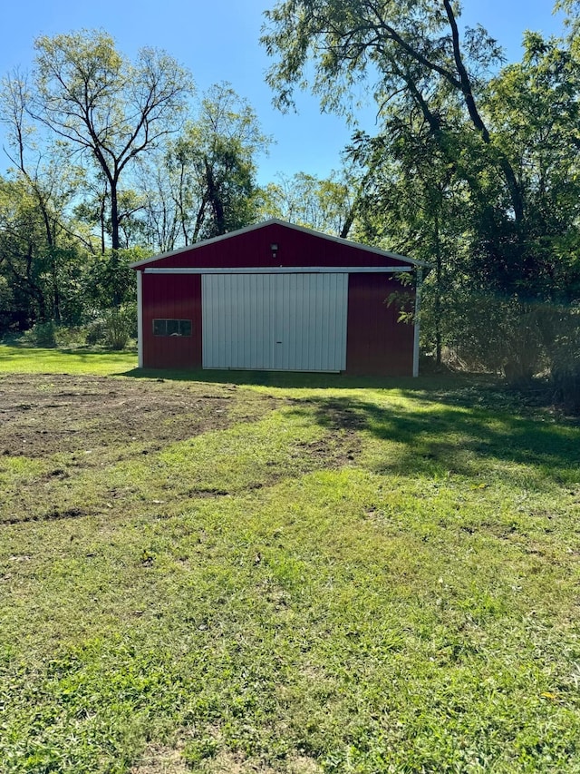 view of outbuilding featuring a lawn