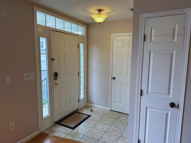 tiled entryway featuring plenty of natural light