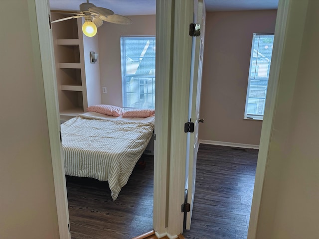 bedroom featuring dark hardwood / wood-style floors and ceiling fan