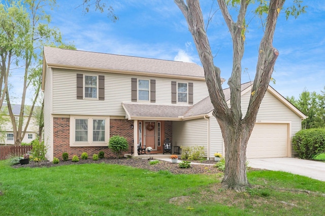 view of property with a front yard and a garage