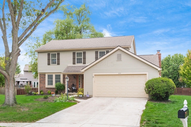 front of property with a garage and a front yard