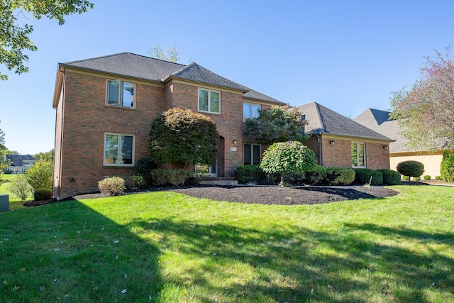 front facade featuring a front yard