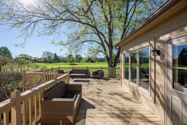 wooden deck with an outdoor living space