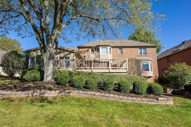 back of house with a yard and a wooden deck