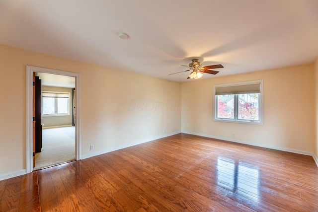 spare room featuring ceiling fan and light wood-type flooring