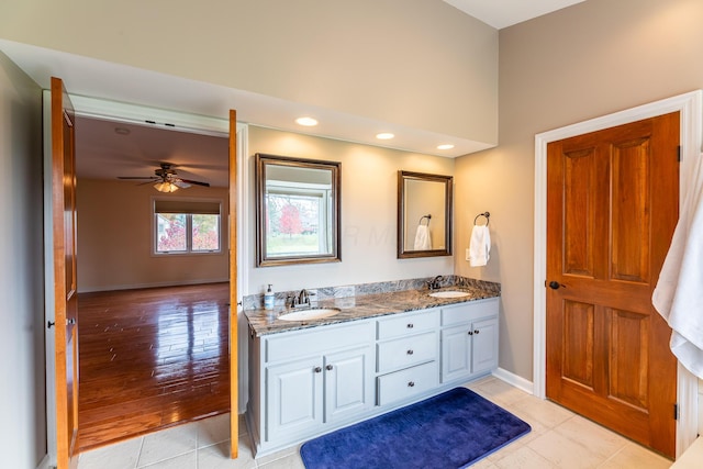 bathroom with vanity, ceiling fan, and wood-type flooring