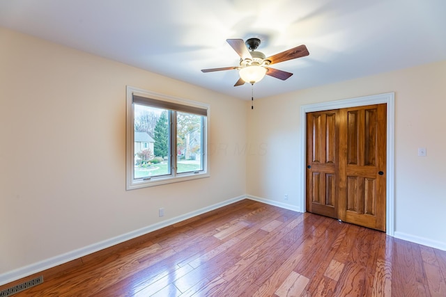 unfurnished bedroom featuring ceiling fan and light hardwood / wood-style flooring