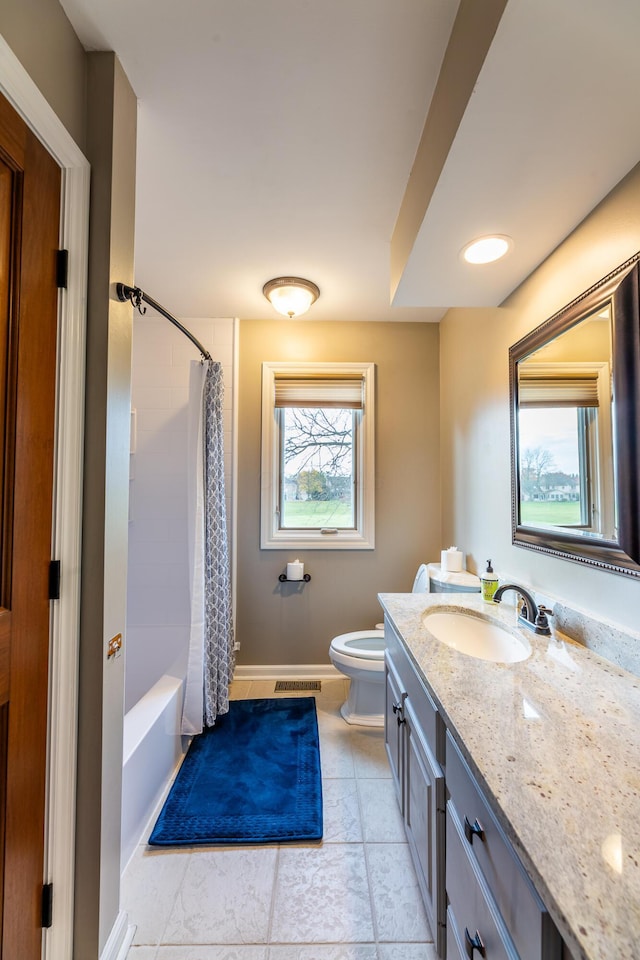 full bathroom featuring tile patterned floors, vanity, shower / bath combo, and toilet