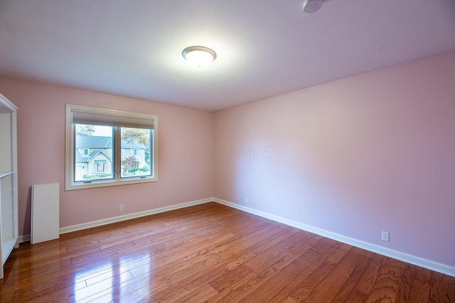 spare room featuring light hardwood / wood-style flooring