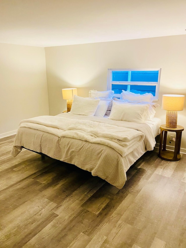 bedroom featuring wood-type flooring