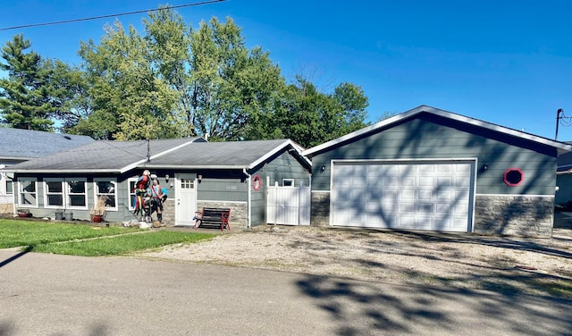 ranch-style home featuring a garage