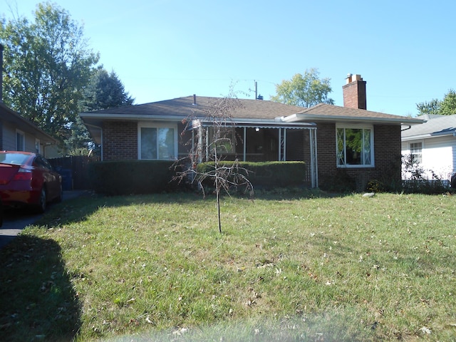 view of front of home with a front lawn