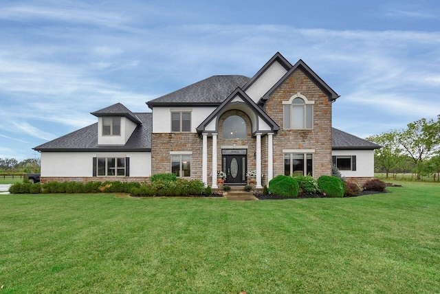 view of front of property with a front lawn