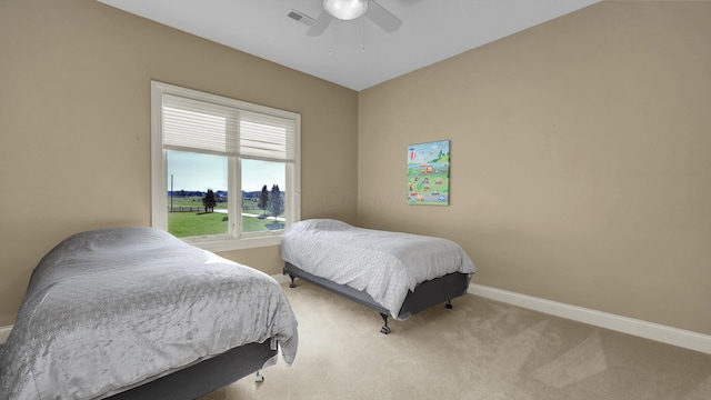 carpeted bedroom featuring ceiling fan